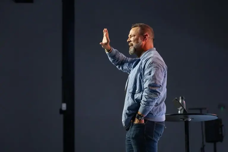 Pastor Joel preaching at Oaks Church